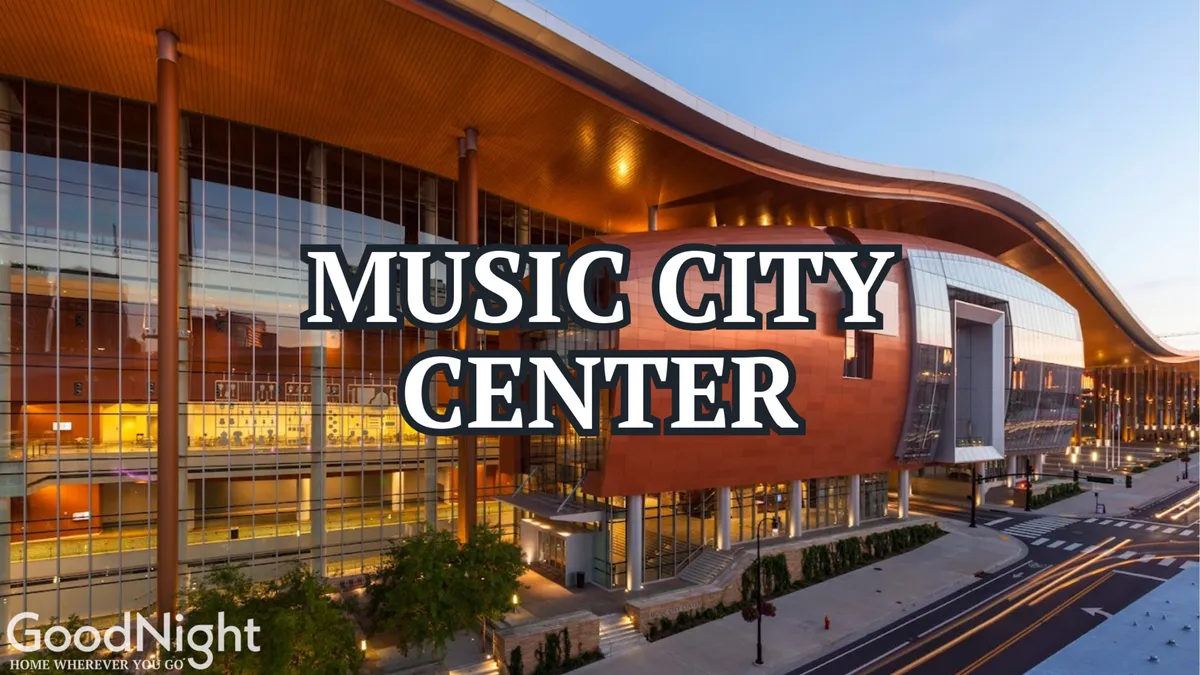 This image showcases the striking exterior of the Music City Center building, surrounded by the city landscape and bustling street view. The modern architectural design and energy of the area are evident, emphasizing downtown Nashville's vibrancy and its status as a business hub.