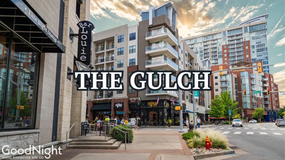 This exterior scene captures people enjoying a lively sidewalk in front of Bar Louie, with restaurant patios and nearby residential buildings. It showcases the energetic social scene and diverse dining options downtown Nashville is known for.